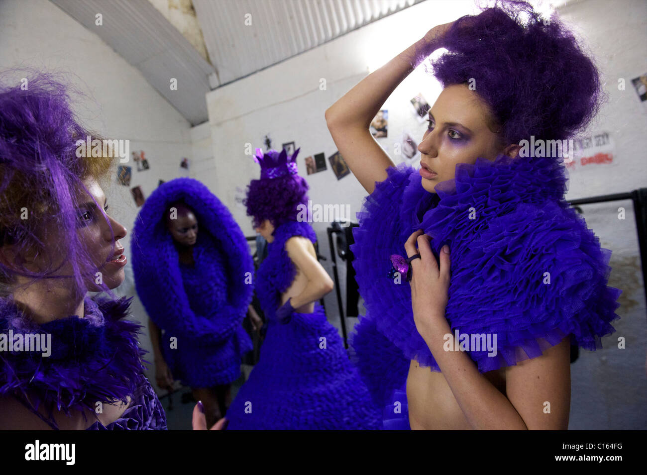 Models assemble backstage readying to exhibit the Pierre Garroudi autumn 2011 collection at his gallery in London on 19 Stock Photo