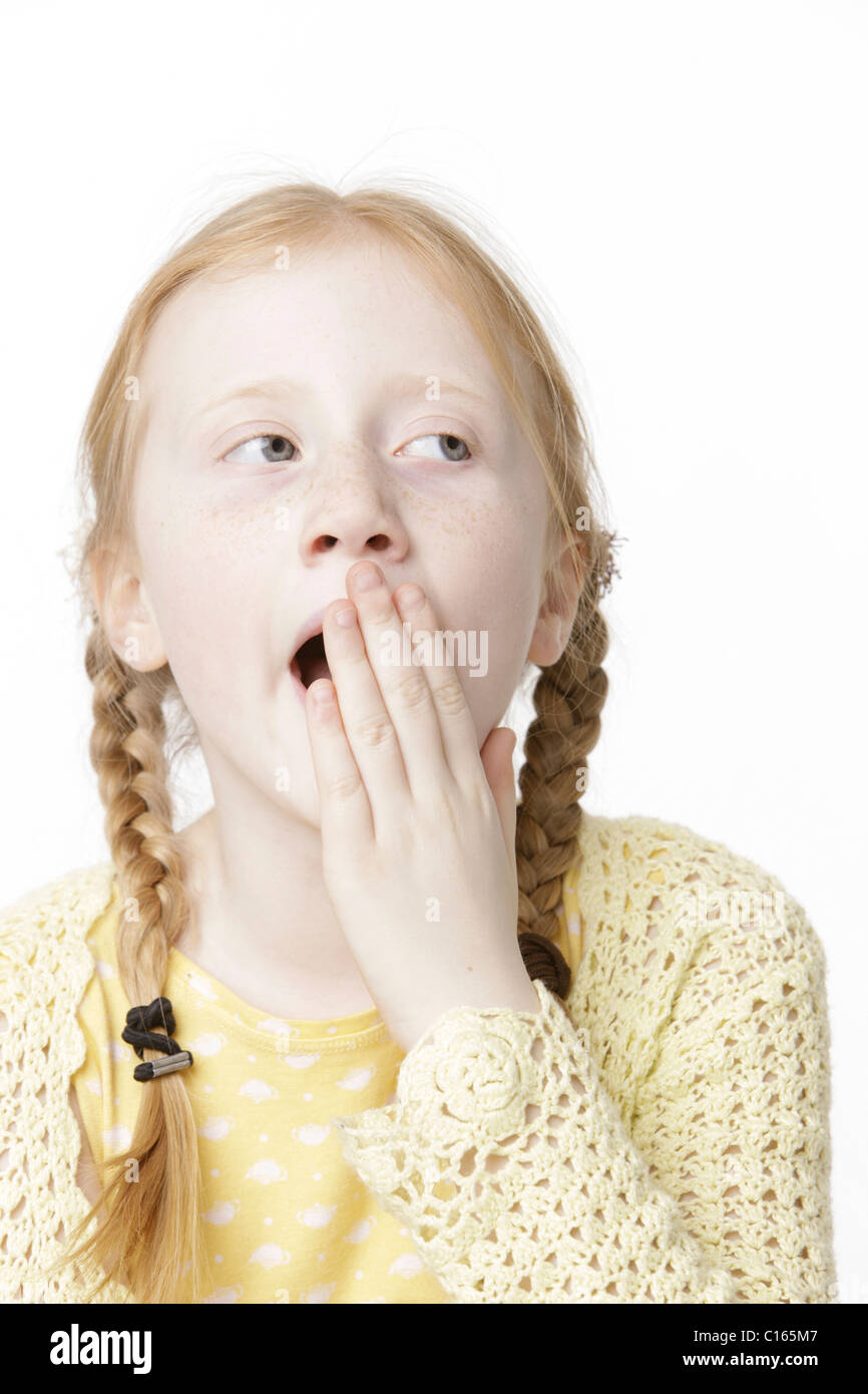 Girl 8 Years Old With Braided Hair Yawning Stock Photo