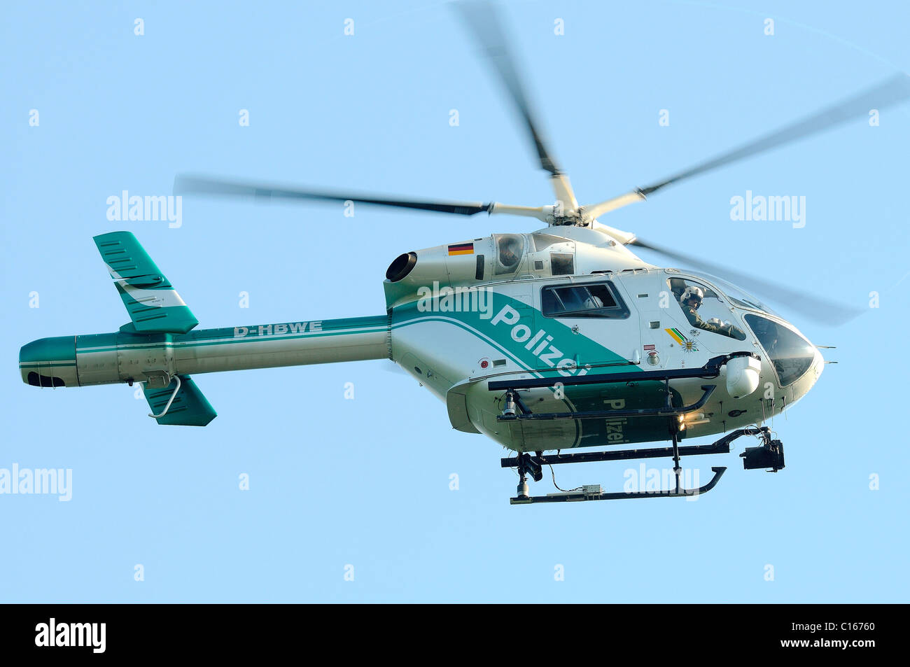 Police helicopter, Bell MD 900 series, also known as Bussard 807, in use after a traffic accident to supervise traffic and to Stock Photo
