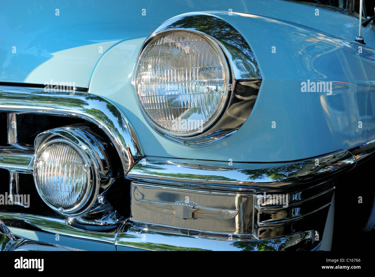 Close-up of the headlights of a 1952 classic blue Cadillac. Stock Photo