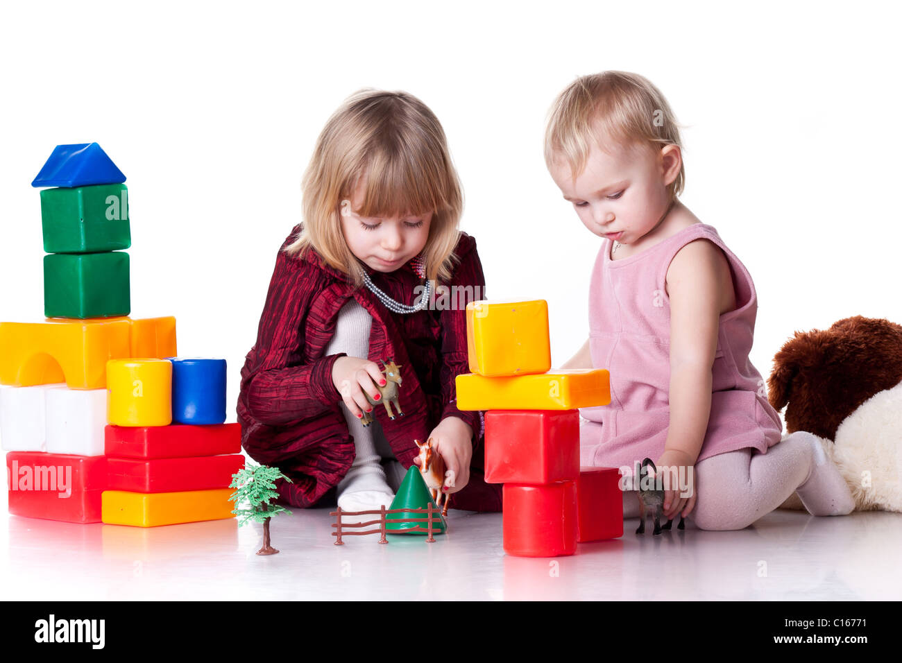 Children playing with blocks isolated on white Stock Photo - Alamy