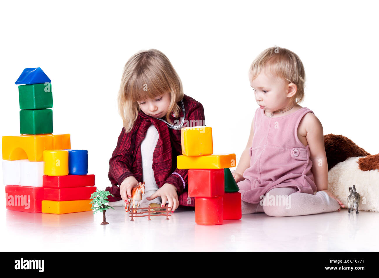Children playing with blocks isolated on white Stock Photo - Alamy