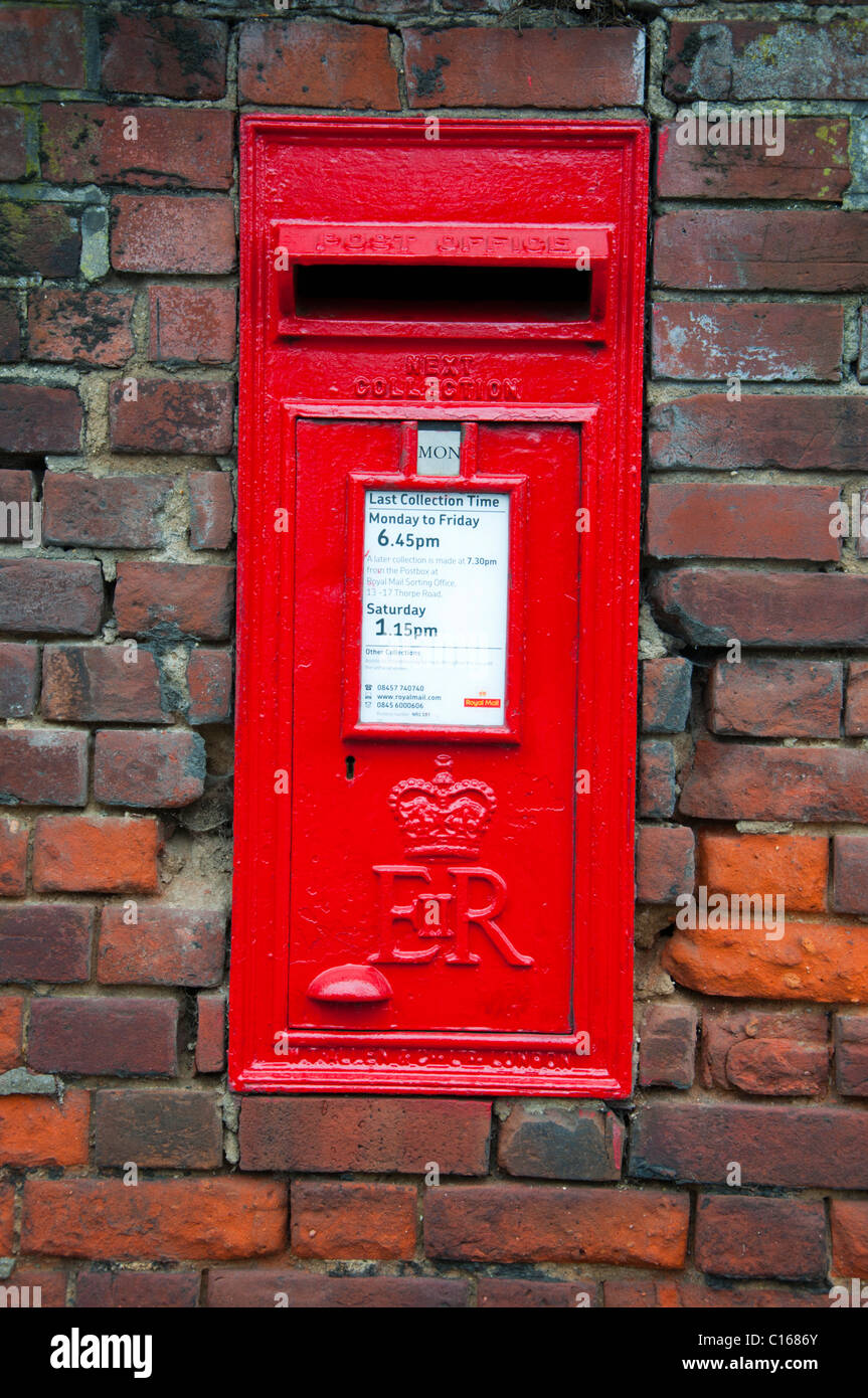 Red post box built into a brick wall Stock Photo - Alamy