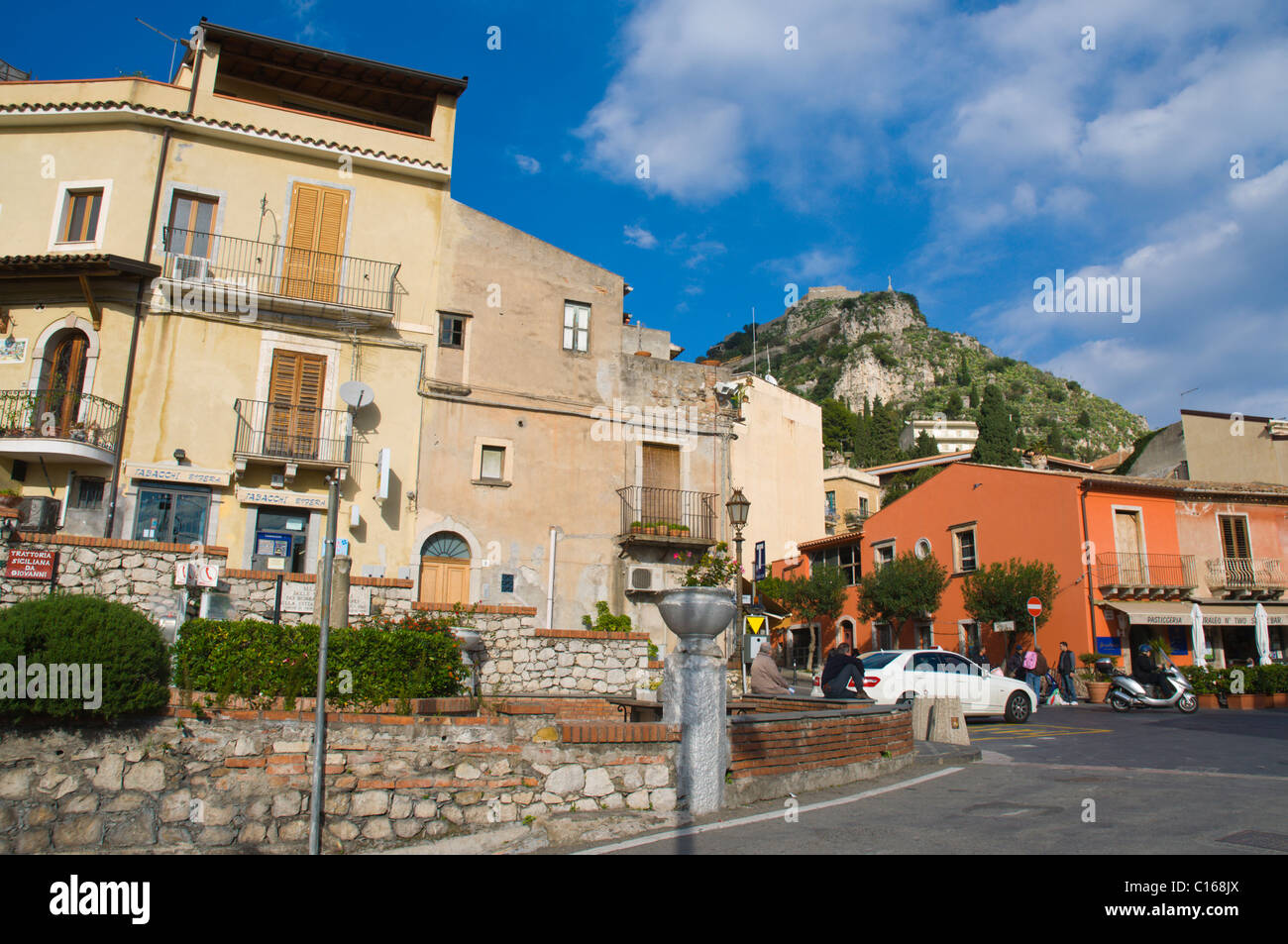 View from Corso Umberto I street to Castelmola castle ruins old town Taormina Sicily Italy Europe Stock Photo