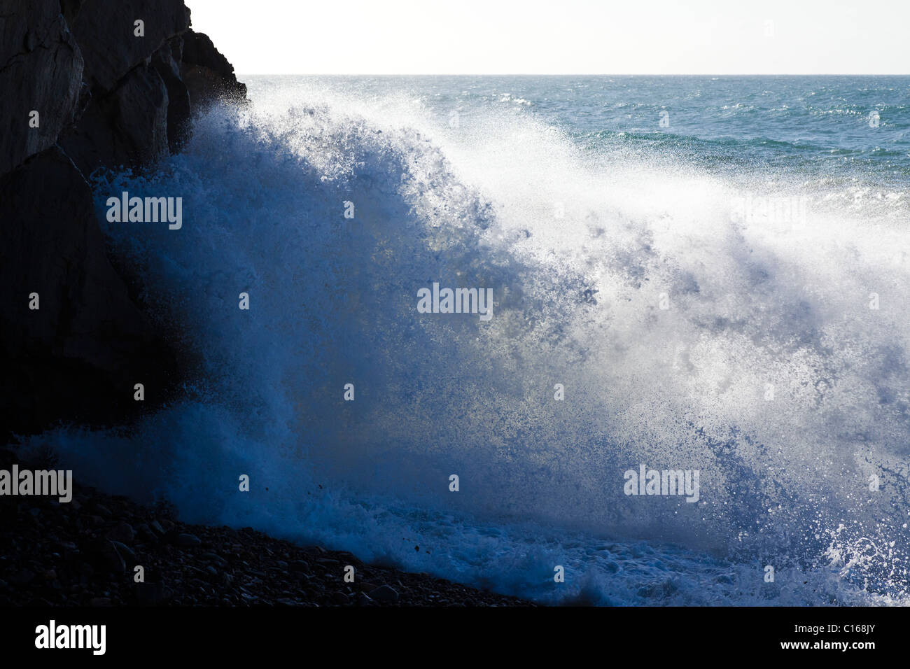 Heavy Atlantic seas with large waves crashing onto rocks at Ajuy on the Canary Island of Fuerteventura Stock Photo