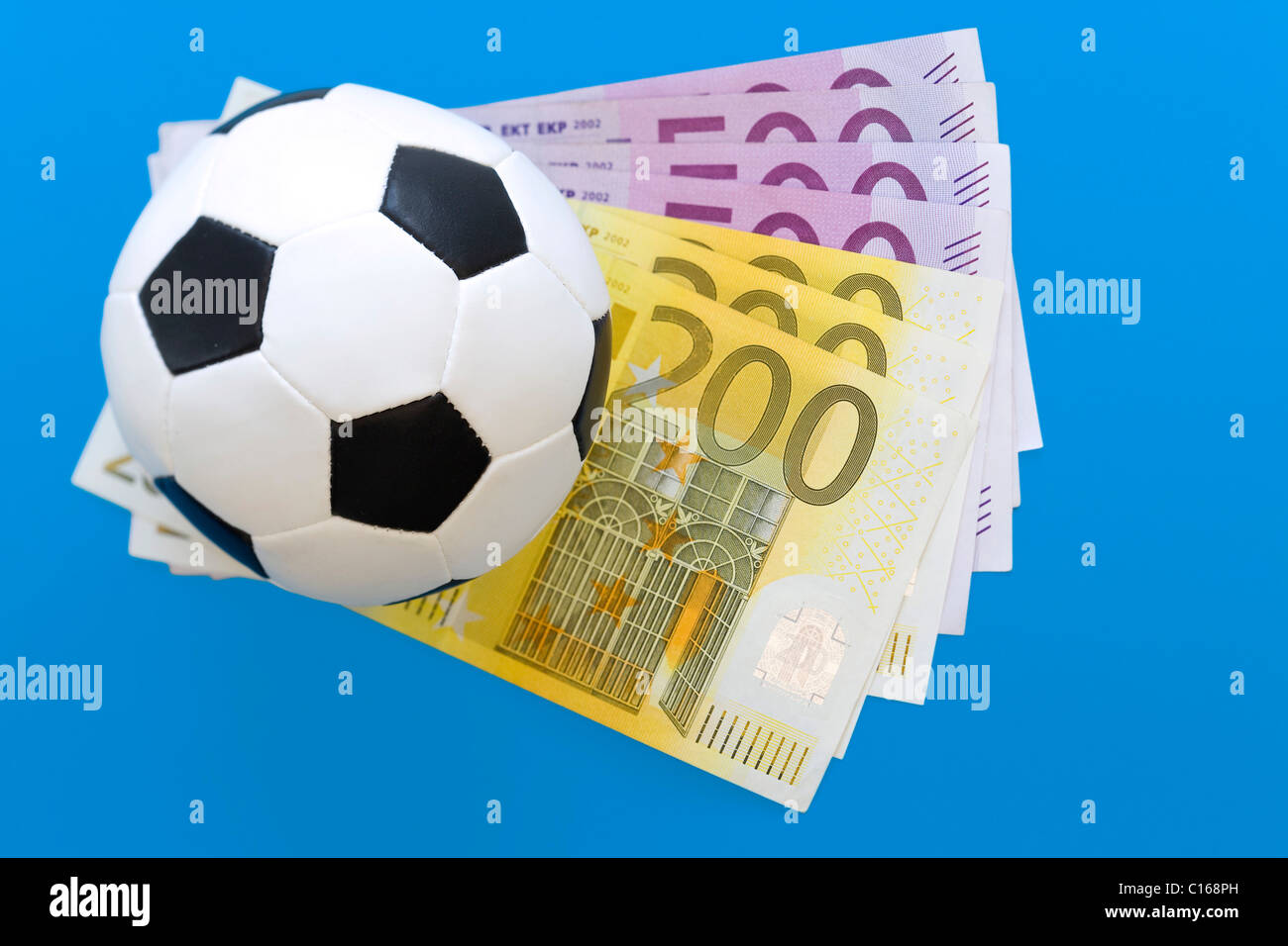 Small soccerball on bills Stock Photo
