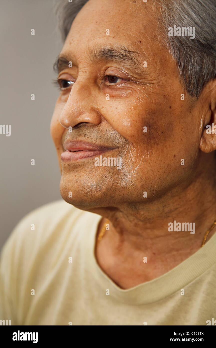 Closeup portrait of an elderly Indian man smiling Stock Photo