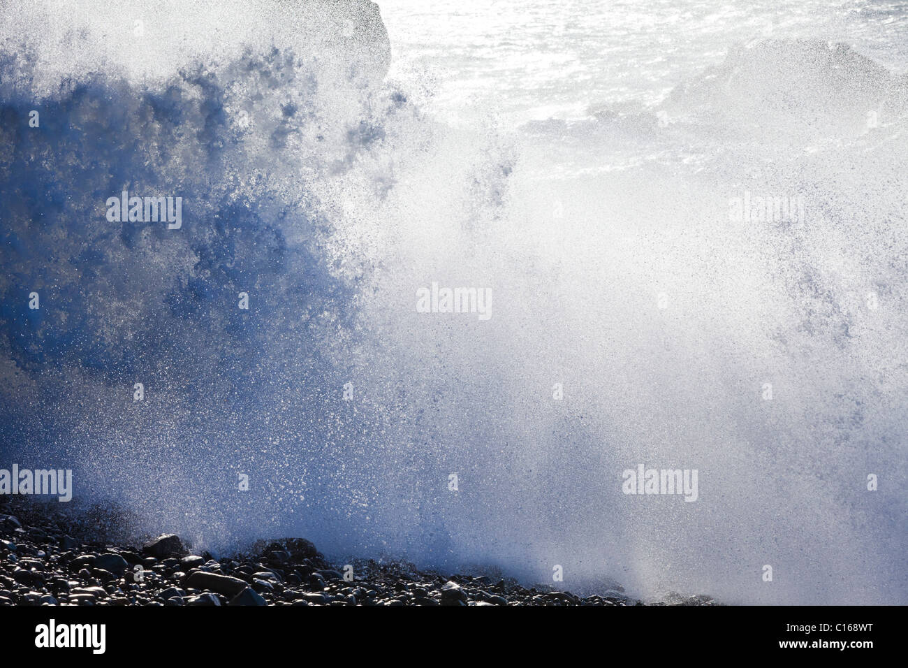 Heavy Atlantic seas with large waves crashing onto rocks at Ajuy on the Canary Island of Fuerteventura Stock Photo