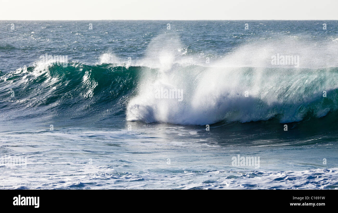 Heavy Atlantic seas with large waves crashing onto the beach at Ajuy on the Canary Island of Fuerteventura Stock Photo