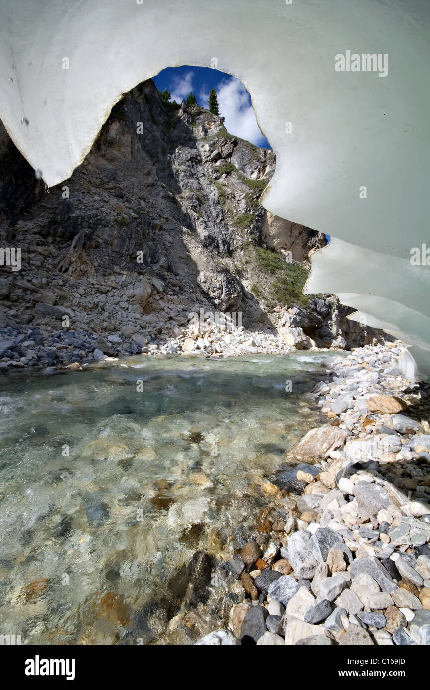Fantastic wavy ice shape (glacier) near river in East Sayan mountains