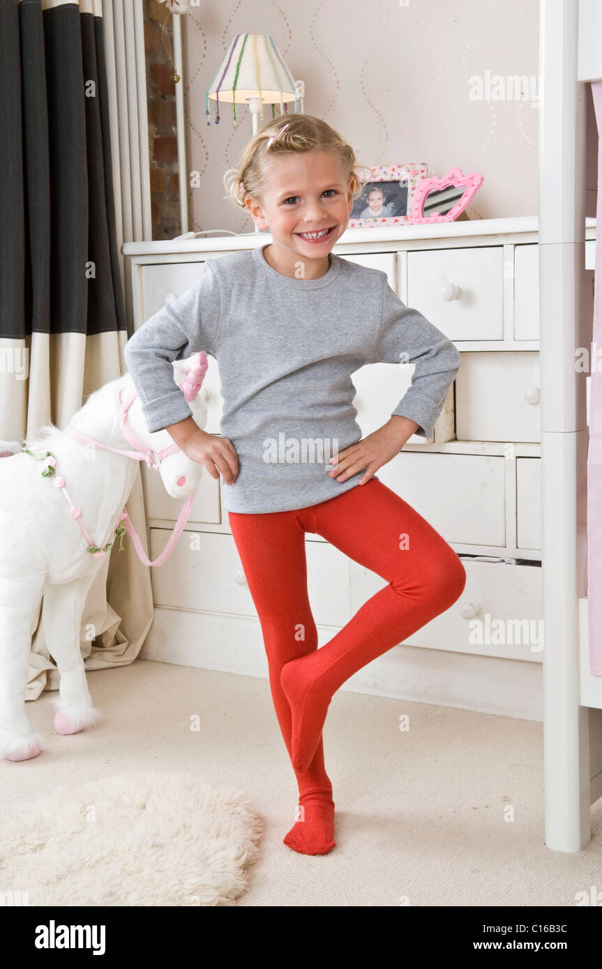 Girl wearing tights in her room Stock Photo - Alamy