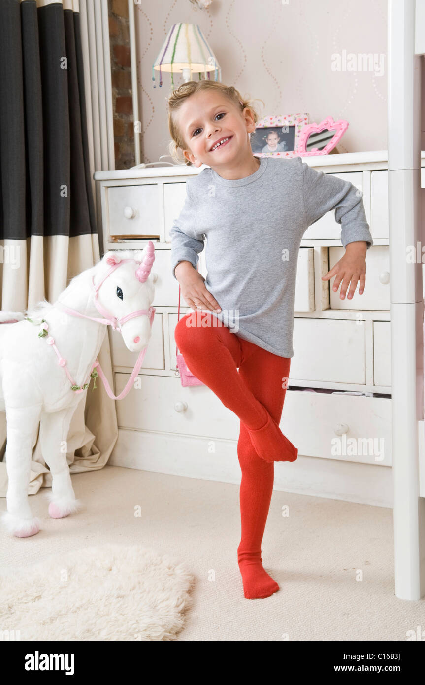 Girl wearing tights in her room Stock Photo