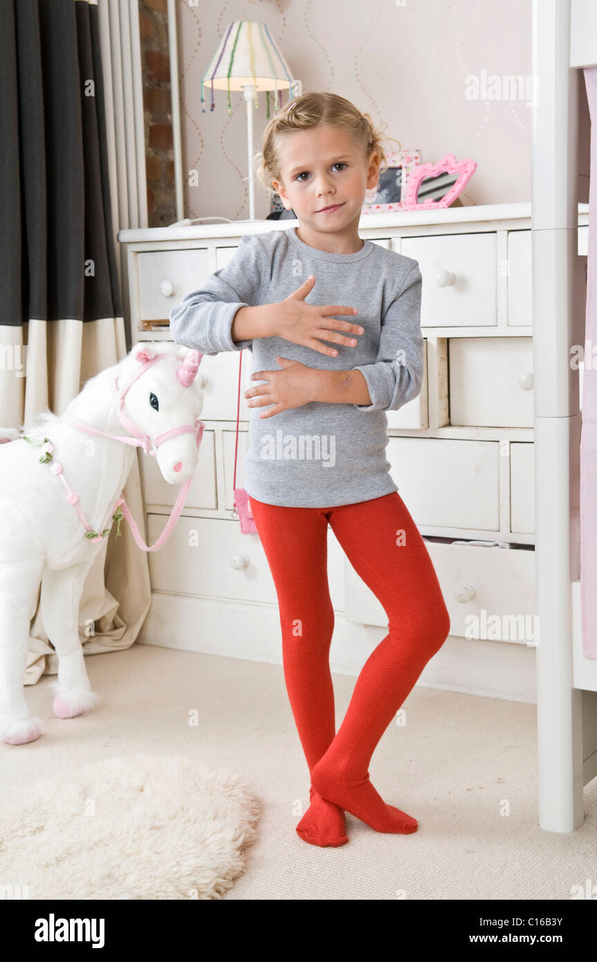 A girl in tights in the nursery Stock Photo