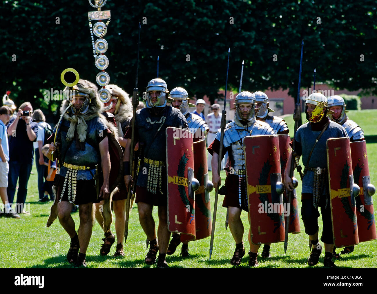 A cohort in roman legionaire uniform marching across the grass, roman games festival, Xanten Archaeological Park, Lower Rhine Stock Photo