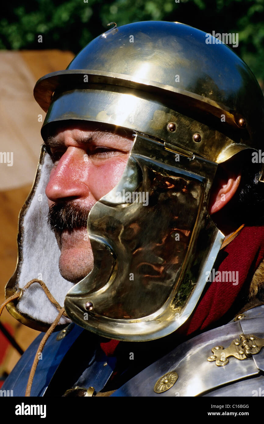 Man with the helmet of a roman legionaire, portrait, roman convention at the Xanten Archaeological Park, Lower Rhine Stock Photo