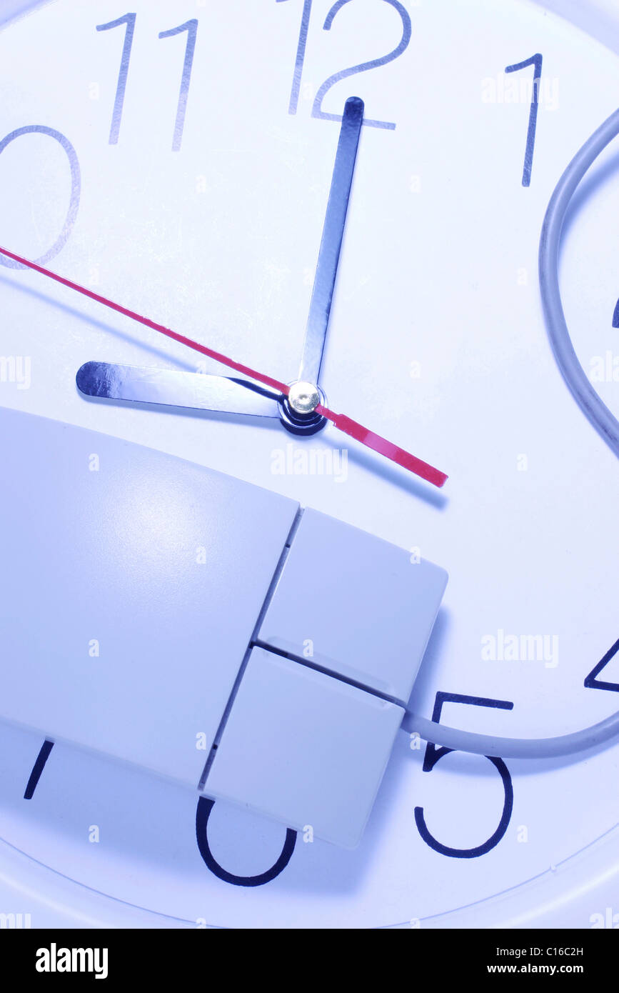 Computer mouse on clock Stock Photo