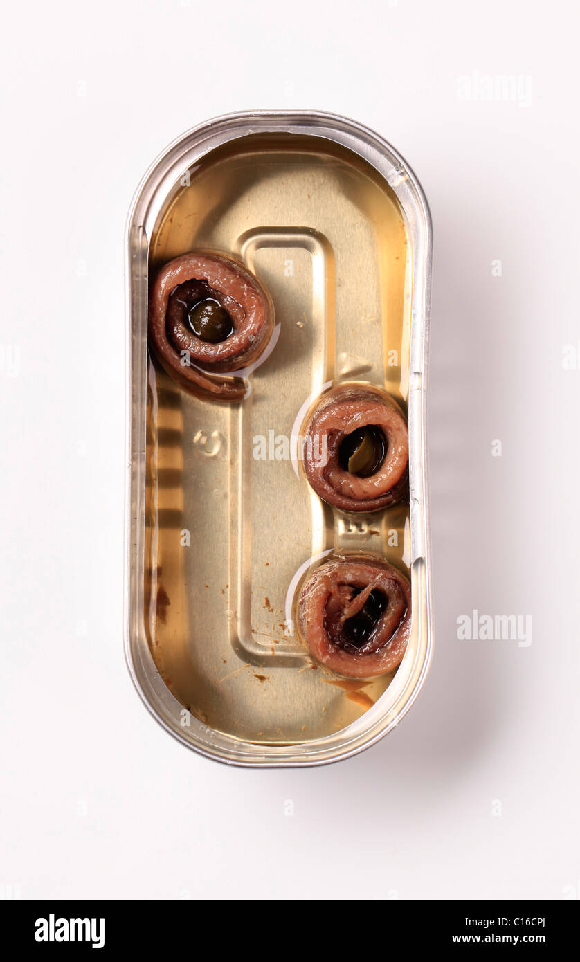 Tin of rolled anchovy fillets in olive oil Stock Photo