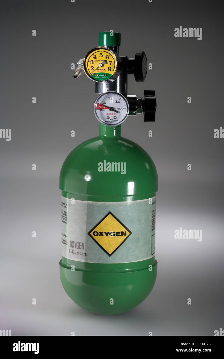 A green oxygen tank with pressure valves Stock Photo Alamy