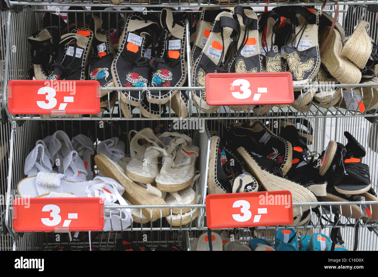 Inexpensive shoes slippers  boots for sale at a bargain shop on Main St  in Chinatown downtown Flushing Queens New York Stock Photo  Alamy