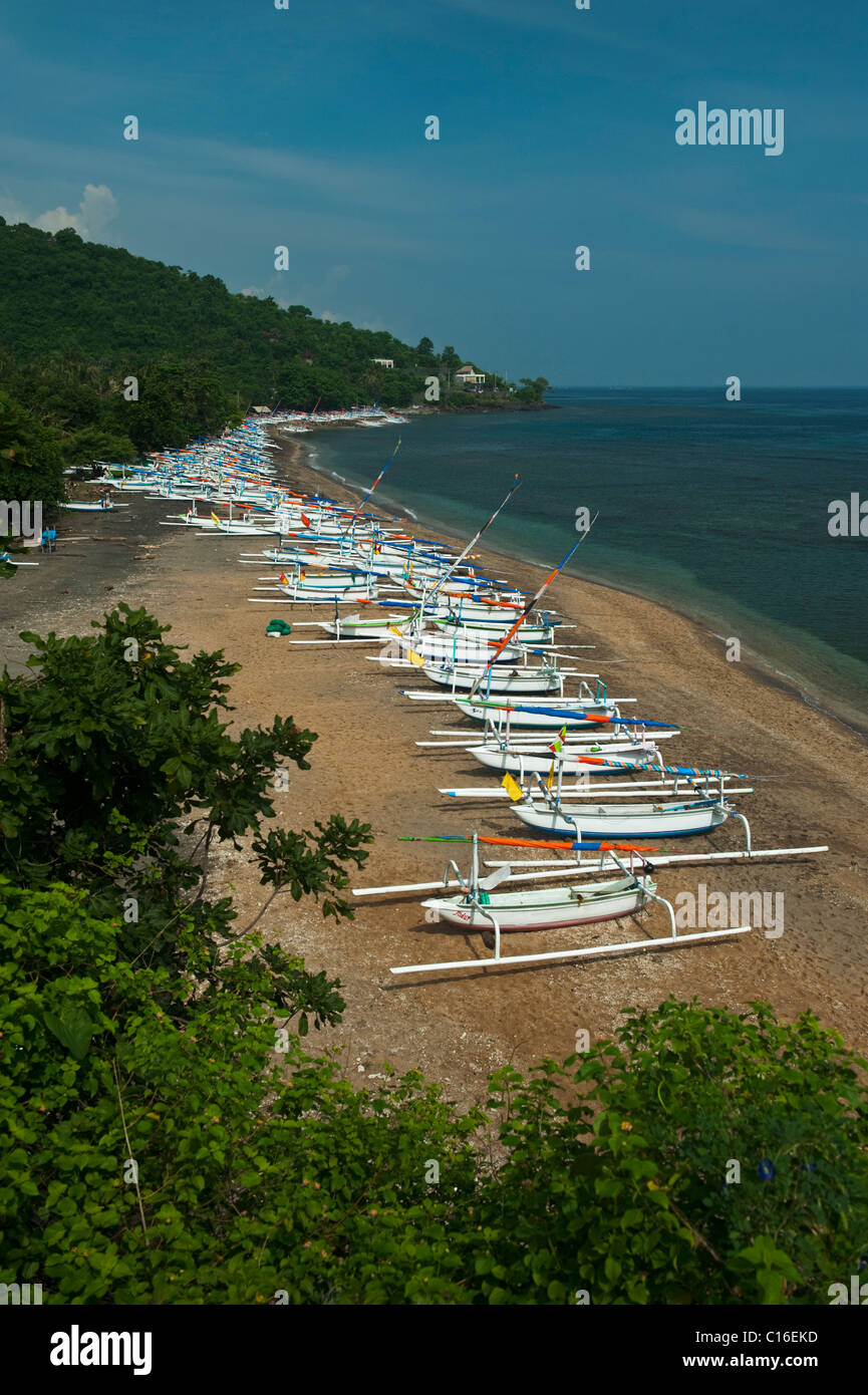 Jemeluk Bay in the Amed area of Bali, Indonesia, is full of traditional fishing boats, called Jukung waiting to go out for work. Stock Photo