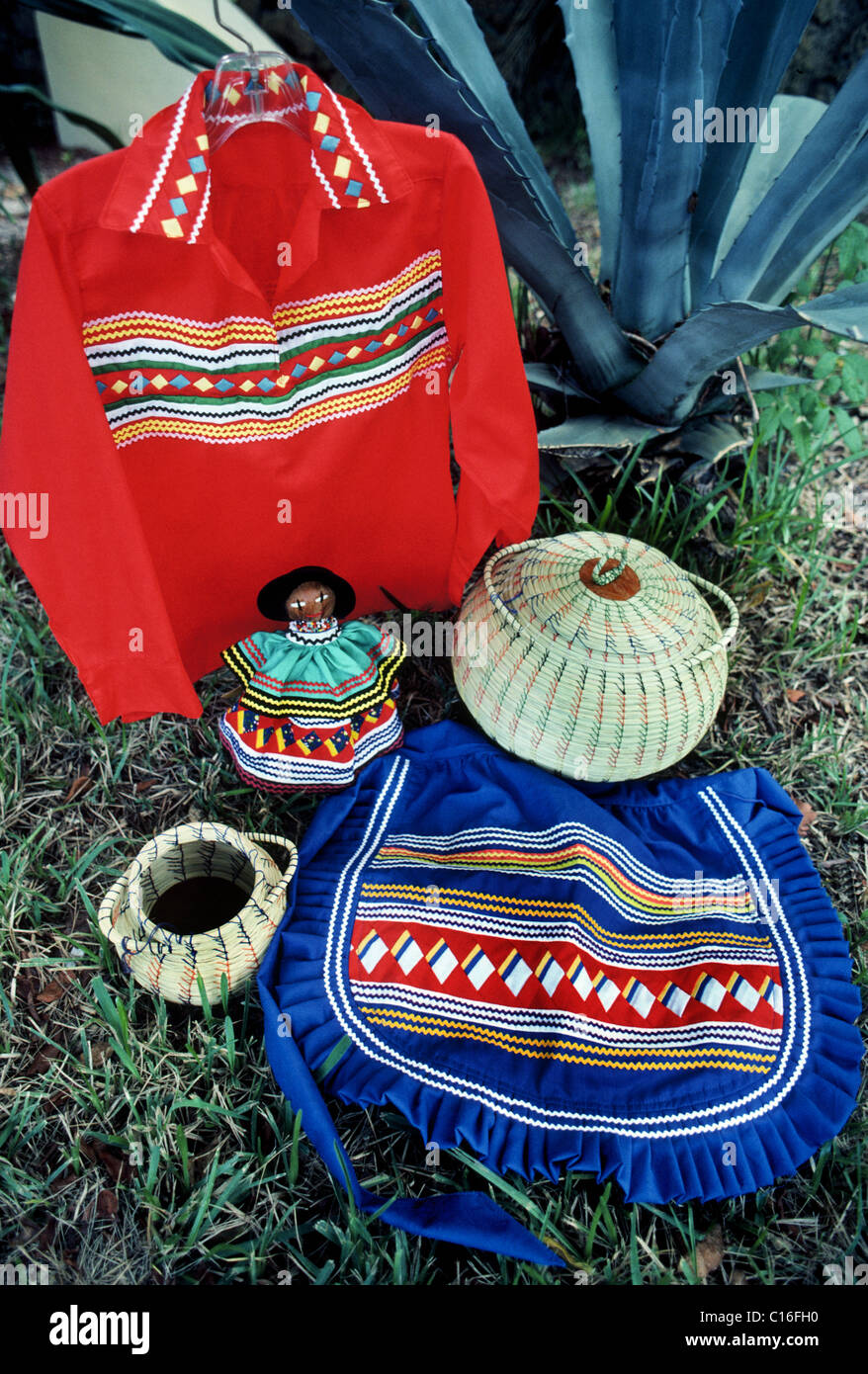 Traditional Miccosukee and Seminole Indian clothing and handicrafts displayed at a tribal village in the Florida Everglades, USA Stock Photo