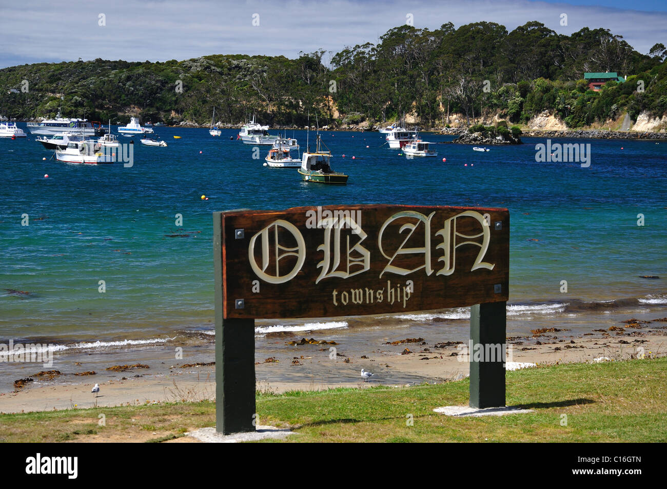 Town sign on foreshore, Oban, Halfmoon Bay, Stewart Island (Rakiura), Southland Region, New Zealand Stock Photo