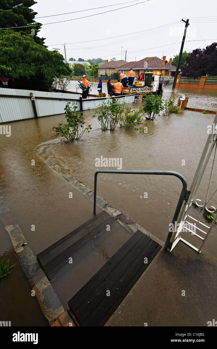 After heavy flash flooding water rises and emergency workers supply