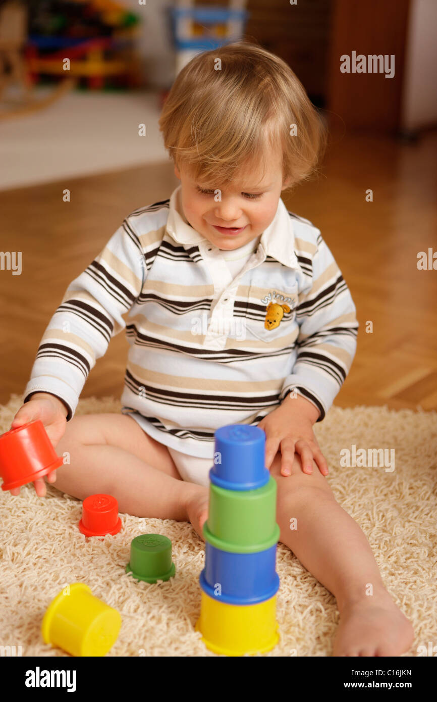 2 year old boy playing in the living room Stock Photo