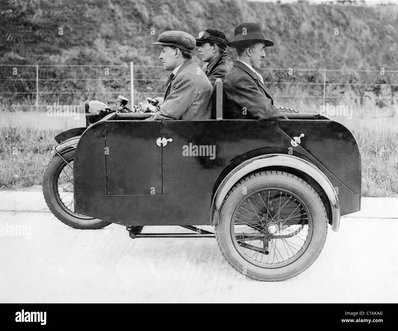 Historic photograph, three men on a motorcycle with a sidecar Stock Photo
