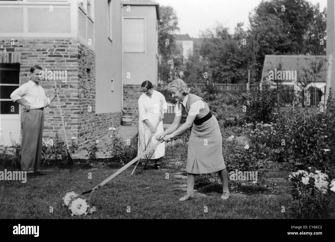 Lawn mowing Black and White Stock Photos & Images - Alamy