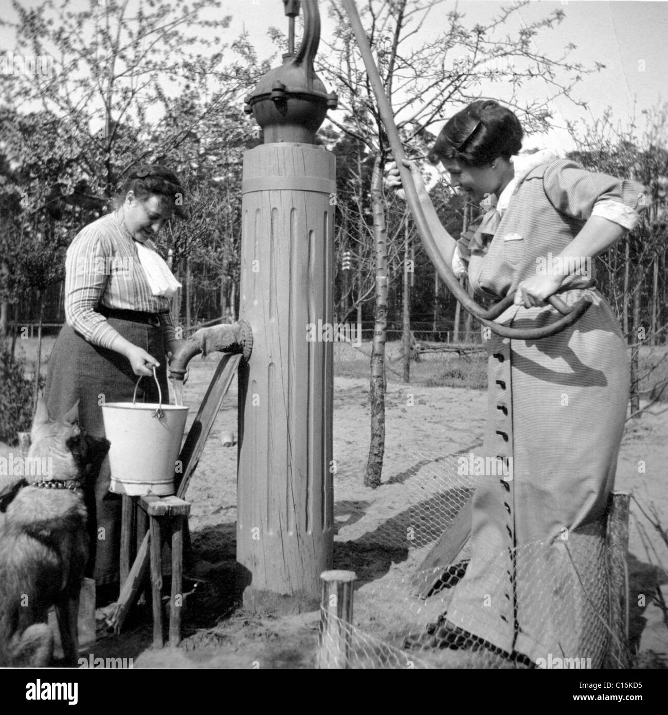 Historic photograph, two women getting water Stock Photo