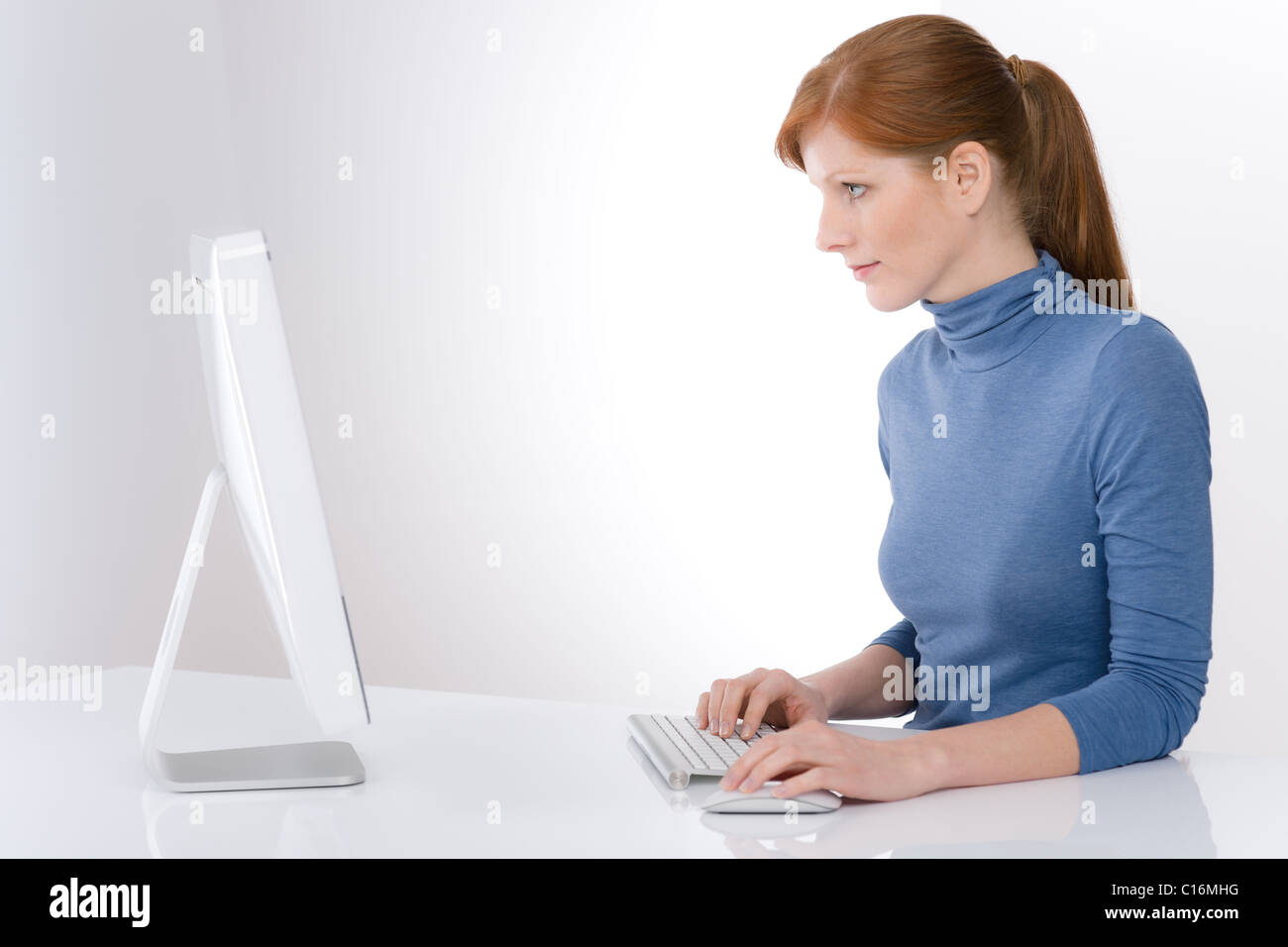 Modern office - young business woman work at computer Stock Photo - Alamy