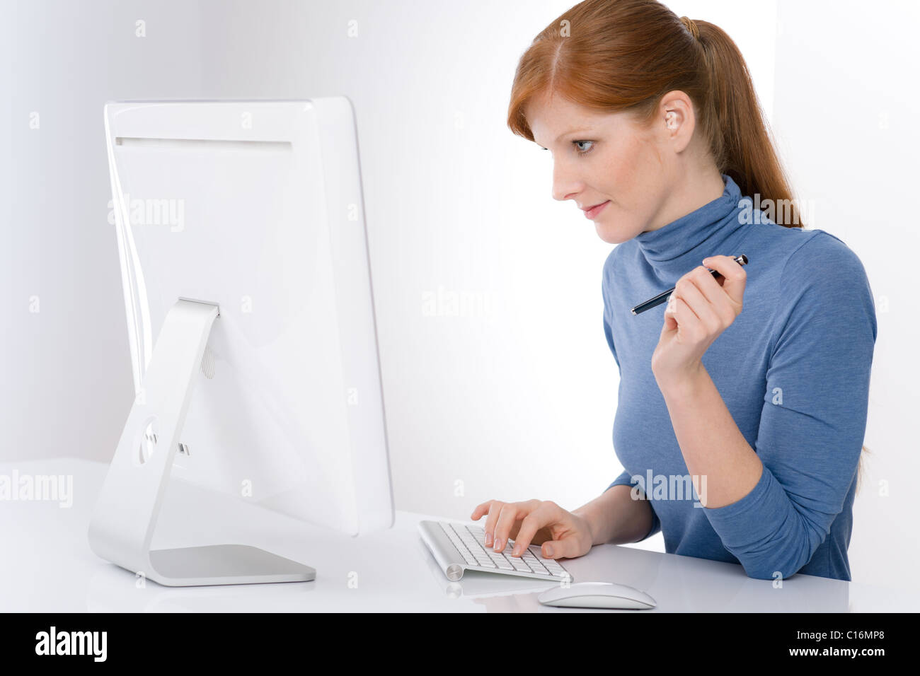 Modern office - young business woman work at computer Stock Photo - Alamy