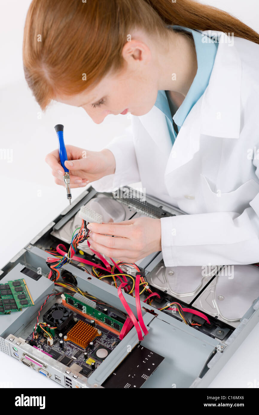 Female support computer engineer - IT woman repair defect Stock Photo