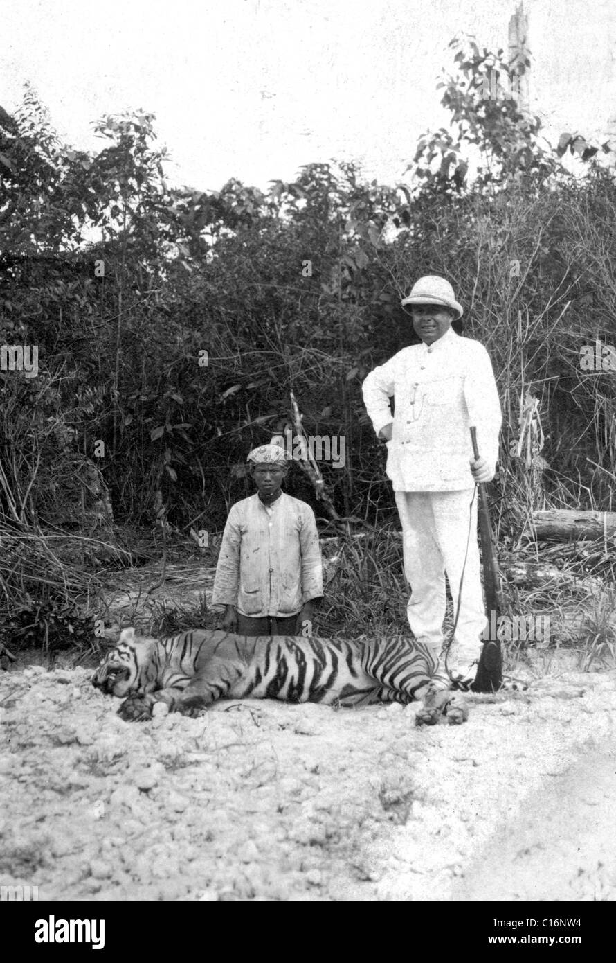 Historic photograph, hunter with a dead tiger Stock Photo