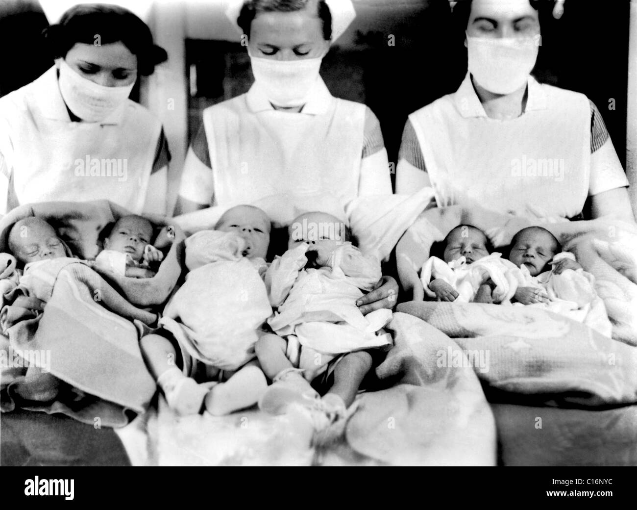 Historic photograph, nurses with newborn children Stock Photo
