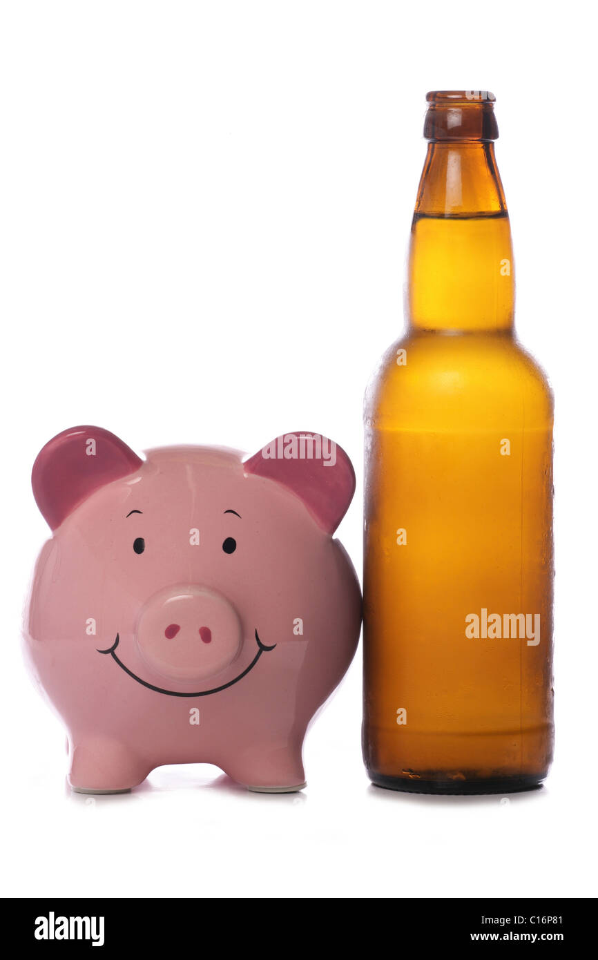Beer bottle with piggy bank studio cutout Stock Photo