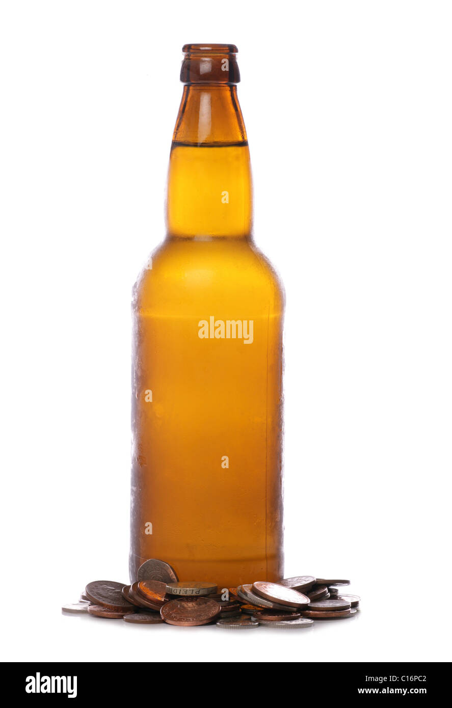 Beer bottle with sterling money studio cutout Stock Photo