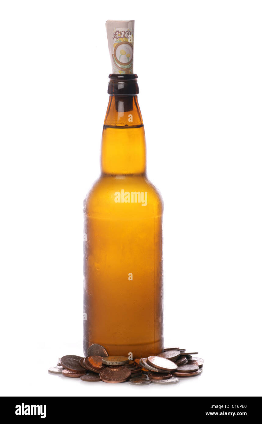 Beer bottle with sterling money studio cutout Stock Photo