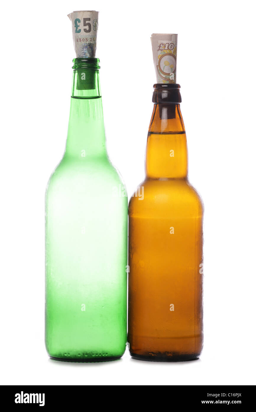 Beer and cider bottles with sterling money studio cutout Stock Photo
