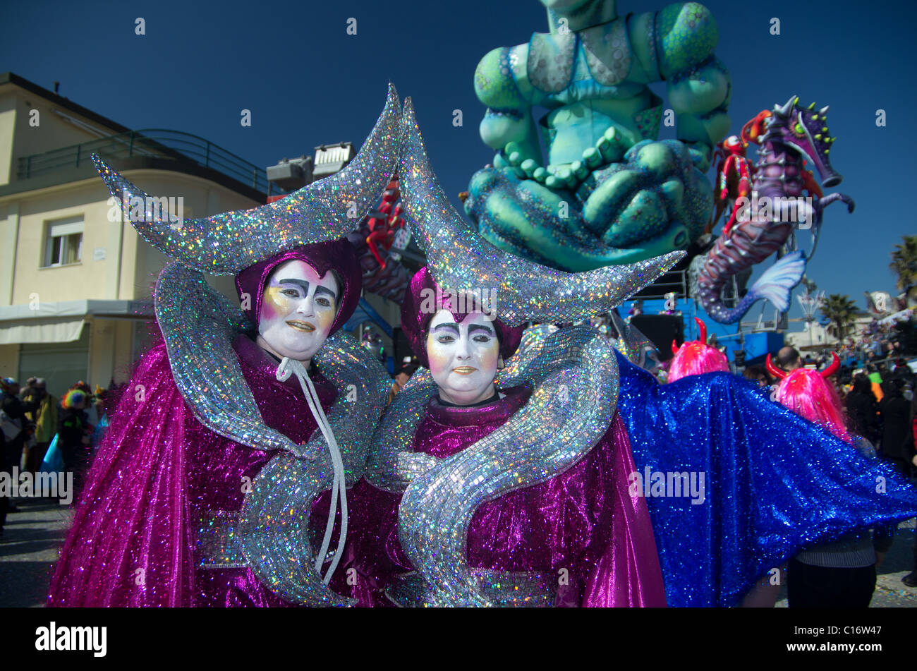 VIAREGGIO, ITALY - MARCH 6:  masked women smiling in carnival mask, during the famous Carnival of Viareggio on march 6, 2011 in Viareggio, Italy Stock Photo