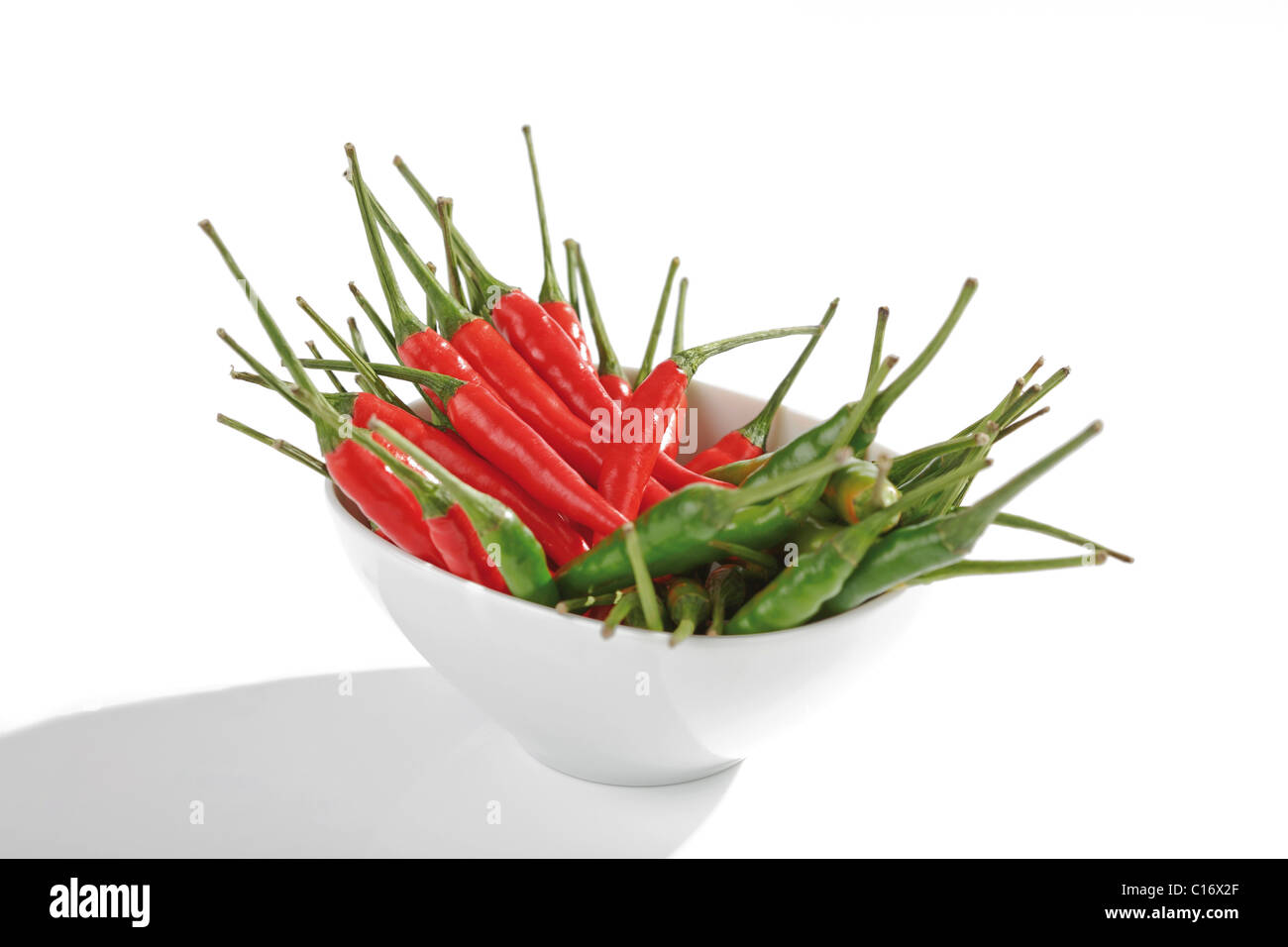 Red and green Thai chillies in a bowl Stock Photo - Alamy