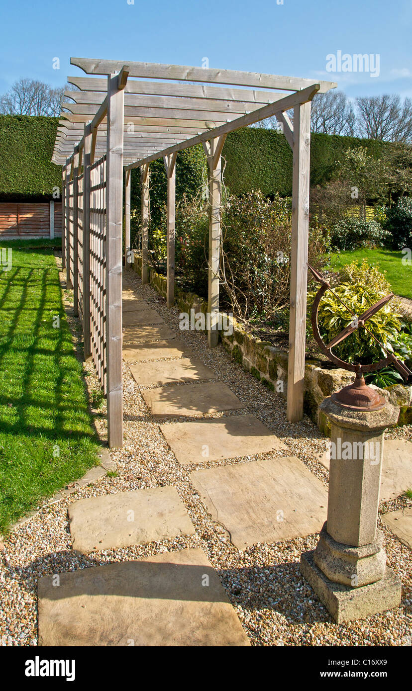 A pergola is a wooden walkway frame used in landscaping a garden Stock  Photo - Alamy