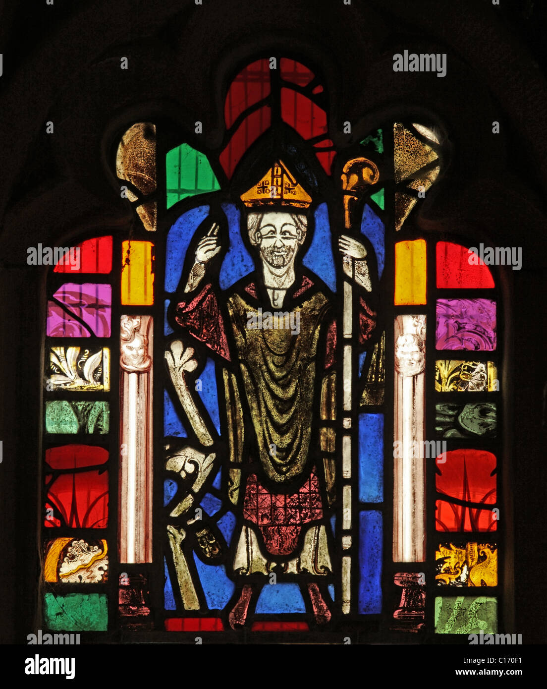 A medieval stained glass window depicting Saint Cuthbert, St Cuthbert's Church, Edenhall near Penrith, Cumbria. Stock Photo