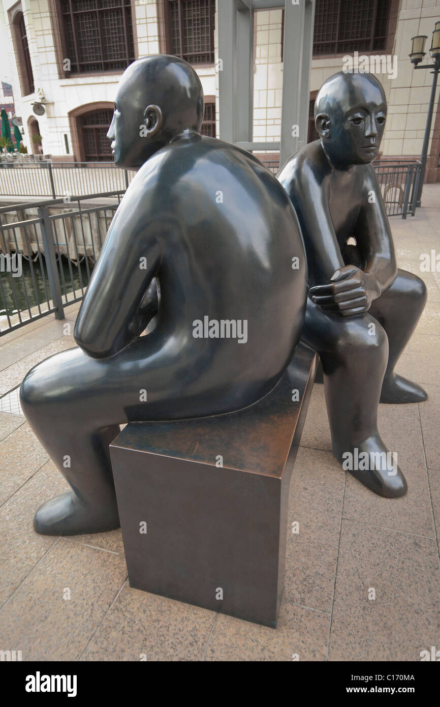 Two Men on a Bench,Giles Penny, Bronze Sculpture Stock Photo