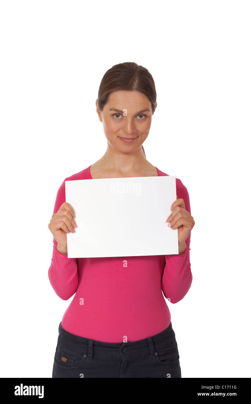 Young woman holding blank sign isolated over white background Stock
