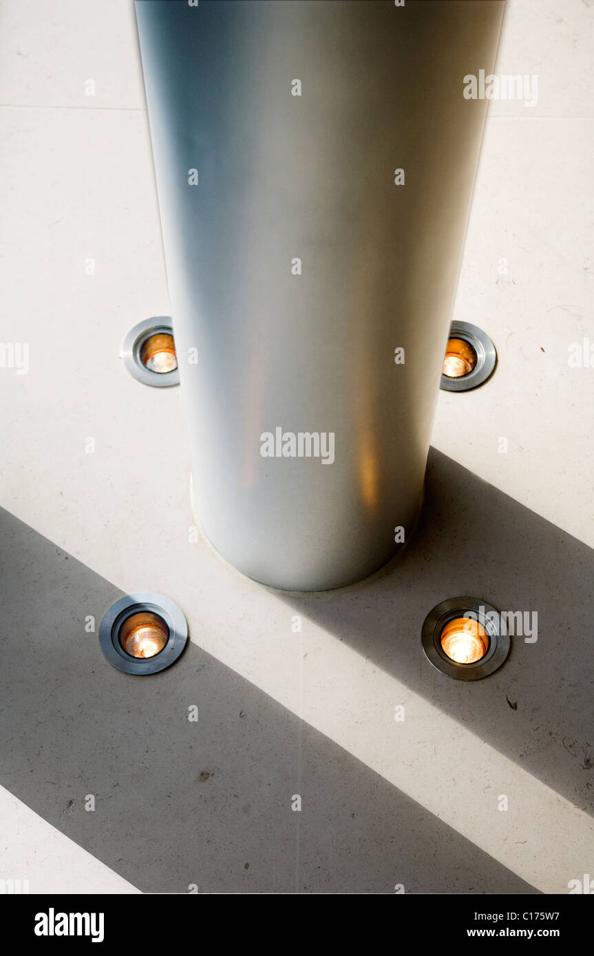 Detail of metal pillar and small floor lights Stock Photo