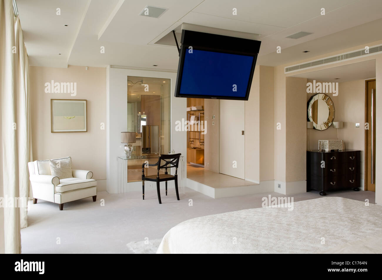 Flat Screen Plasma Tv Mounted To The Ceiling In Modern