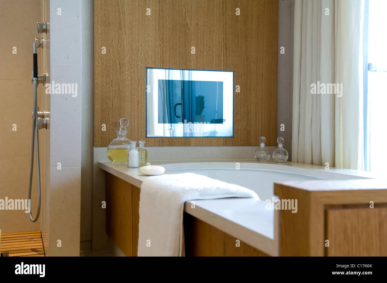 Plasma screen TV in luxury modern bathroom Stock Photo