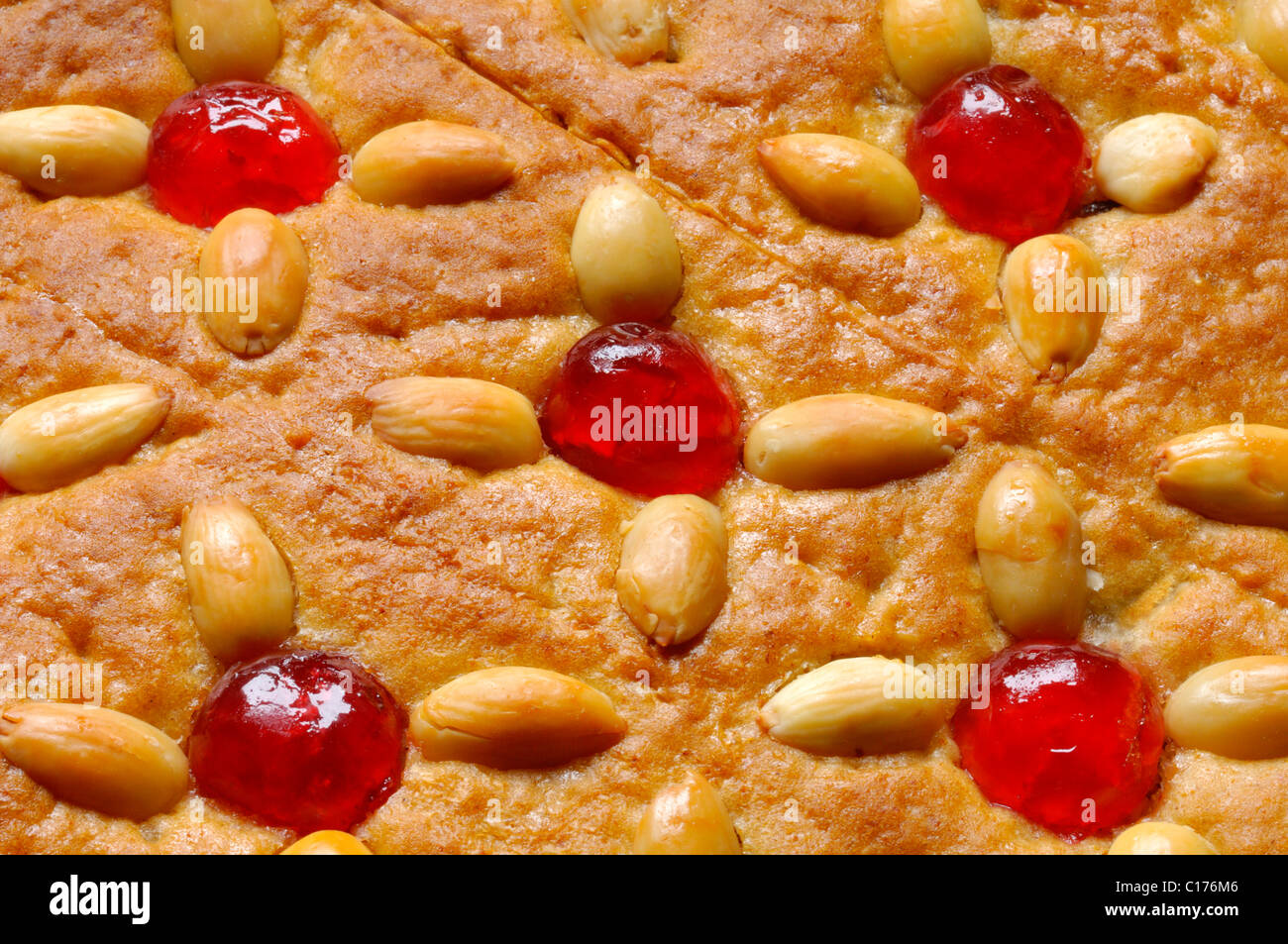 Honey cake with almonds and Maraschino cherries Stock Photo